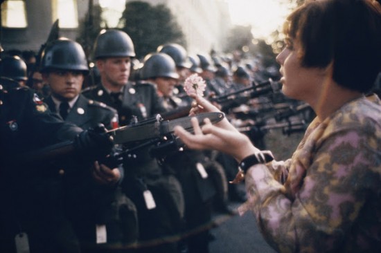 "La Jeune Fille a la Fleur," a photograph by Marc Riboud, shows the young pacifist Jane Rose Kasmir planting a flower on the bayonets of guards at the Pentagon during a protest against the Vietnam War on October 21, 1967. The photograph would eventually become the symbol of the flower power movement.