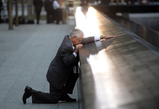 Robert Peraza pauses at his son's name on the 9/11 Memorial during the tenth anniversary ceremonies at the site of the World Trade Center.