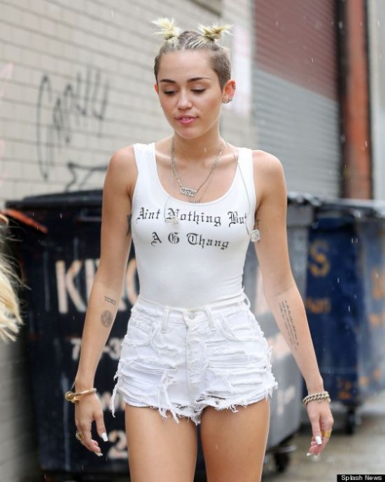 Miley Cyrus wears a tank top inscribed, "Ain't Nothing But a G Thang" when out in about in Brooklyn, NY