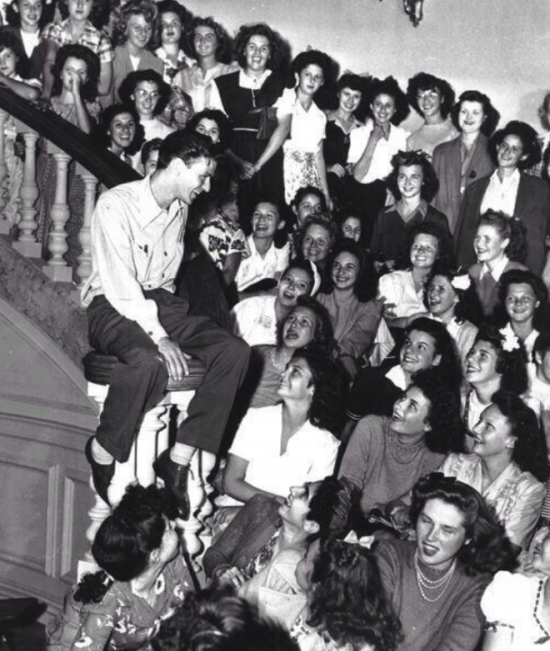 Frank Sinatra surrounded by his fans in 1943