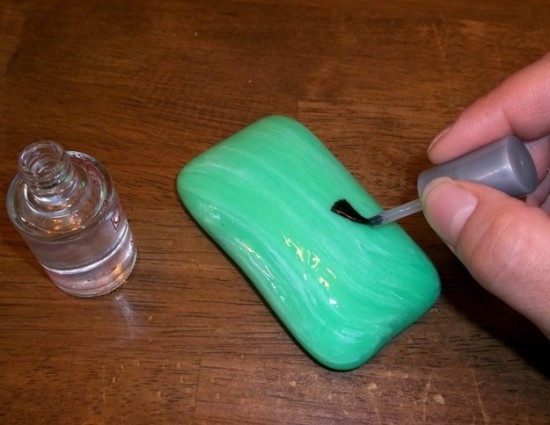 Paint a bar of soap with finger nail polish and leave it in the shower