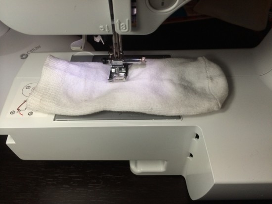 Sew one of your kid’s socks closed halfway down