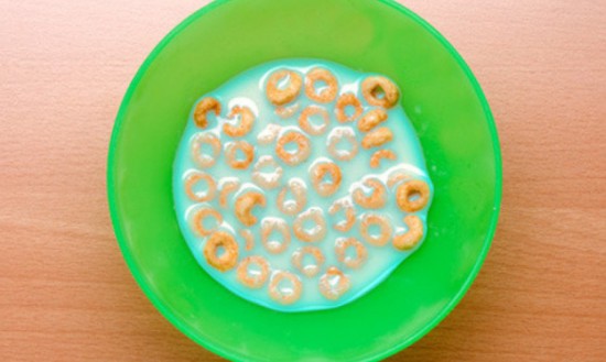 Squeeze a few drops of dye into the bottom of your kid’s bowl, then cover it with cereal