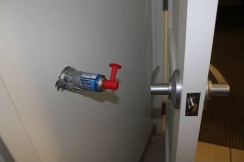 ape an air horn to the wall next to the door