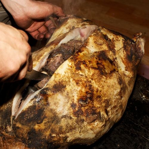 Mongolian Boodog - Goat. cooked within its own skin by hot stones (Mongolia)