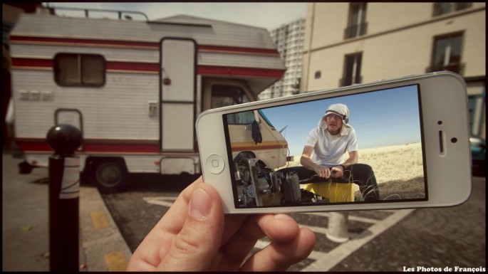 Movie and TV scenes on an iPhone held up in front of perfect real-life backgrounds 007