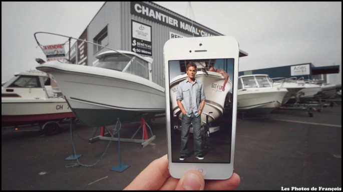 Movie and TV scenes on an iPhone held up in front of perfect real-life backgrounds 016