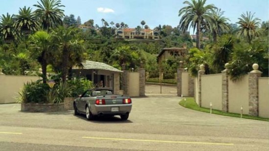 a private entrance that leads up to a mansion